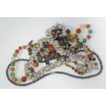 NECKLACE OF VARIOUS HARDSTONE BEADS with crystal spacers; shell necklace; long necklace of coral,