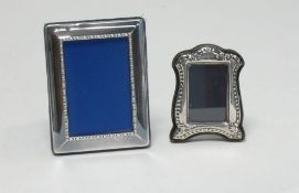 MODERN EMBOSSED SILVER FRONTED SMALL PHOTOGRAPH FRAME, with blue plush covered easel support, 3 1/2"