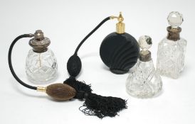 TWO CUT GLASS SCENT BOTTLES AND STOPPERS with silver collars, 6" (15.2cm) high, the larger, and