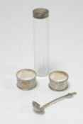 TWO ENGRAVED SILVER NAPKIN RINGS, one initialled, TOGETHER WITH A FACET CUT GLASS TOILET JAR with
