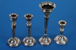 PAIR GEORGIAN STYLE SMALL SILVER CANDLESTICKS with campana scones and tapering items and with