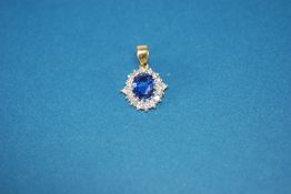 AN APPARENTLY TESTED 18ct YELLOW AND WHITE GOLD PENDANT ADAPTED FROM A RING, set with a cornflower