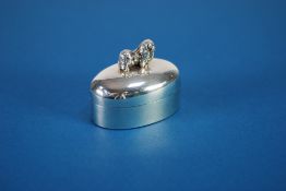 EDWARDIAN PLAIN SILVER SMALL OVAL BOX, with close fitting domed removable lid with Pekinese dog