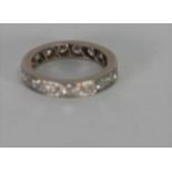 PLATINUM AND DIAMOND ETERNITY RING, set with eighteen round brilliant cut diamonds, each approx .