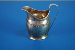 GEORGE III SILVER HELMET SHAPED CREAM JUG, with reeded banded border and raised 'C' scroll raised