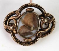 VICTORIAN GOLD AND BLACK ENAMELLED LARGE OPENWORK FOLIATE SCROLL MOURNING BROOCH, quatrefoil