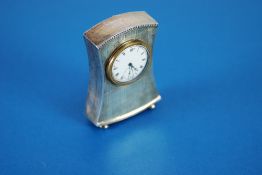 SILVER DRESSING TABLE CLOCK with mechanical keyless movement,. white porcelain circular Roman dial