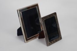 TWO MODERN SILVER FRONTED PHOTOGRAPH FRAMES with Sheffield Millennium hallmarks, one with slender