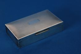 A CEDAR LINED SILVER CIGARETTE BOX, with engine turned cover, Birmingham 1948