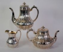 FINE VICTORIAN SILVER THREE PIECE TEA AND COFFEE SET by John Samuel Hunt, of pyriform with scroll