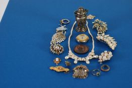 VICTORIAN WING SHAPED BROOCH SET, with three tiny rubies and two seed pearls and having glazed