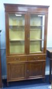 EDWARDIAN SHERATON REVIVAL INLAID MAHOGANY DISPLAY CABINET with to glazed doors over two short