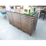 A MAHOGANY SIDEBOARD, WITH RIBBED EFFECT FRONT AND SIDES, FOUR DRAWERS TO CENTRAL SECTION, FLANKED