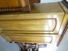 A VICTORIAN FLAME MAHOGANY WARDROBE, TWO SOLID DOORS, ENCLOSING TWO HANGING COMPARTMENTS OVER ONE