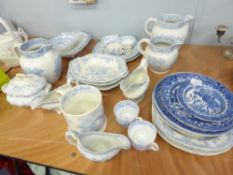 A GRADUATED SET OF THREE 'WILLOW PATTERN' POTTERY GLOBULAR JUGS, A QUART MUG, A SET OF SEVEN