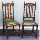 TWO PAIRS OF JACOBEAN STYLE DINING CHAIRS each pair having carved and pierced top rails, rail