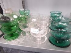 SET OF SIX GREEN GLASS SUNDAE DISHES, SET OF SIX GLASS SUNDAE DISHES WITH FLORAL ENGRAVED DECORATION