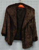 LADY'S BROWN DYED ERMINE JACKET with shawl collar, hook fastening double breast front
