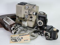 KODAK SIX-20 BROWNIE FOLDING VEST-POCKET CAMERA together with a Kodak BROWNIE 8mm MOVIE CAMERA,