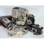 KODAK SIX-20 BROWNIE FOLDING VEST-POCKET CAMERA together with a Kodak BROWNIE 8mm MOVIE CAMERA,