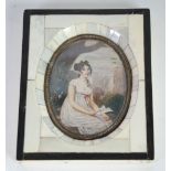 OVAL PRINTED PORTRAIT MINIATURE OF A LADY IN A 'PIANO KEY' FRAME