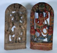 NEAR PAIR OF INDIAN CARVED AND PIERCED WOOD PANELS each of milestone form, carved in high relief