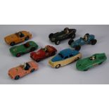 FIVE DINKY TOYS CIRCA 1950s PLAYWORN SPORTS CARS, viz no 111 Triumph TR2 pink, no 108 M.G. Midget