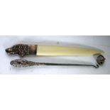 A POSSIBLY FRENCH WHITE METAL 'DOG'S HEAD' HANDLED BONE LETTER KNIFE, also a silver handled steel