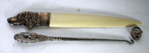 A POSSIBLY FRENCH WHITE METAL 'DOG'S HEAD' HANDLED BONE LETTER KNIFE, also a silver handled steel