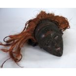 CHOKWE CARVED WOOD FEMALE DANCE MASK, with facial scarification and raffia and natural fibre wig, 8"