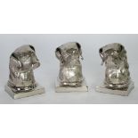 A PAIR AND ONE ODD MODERN WHITE METAL DOGS HEAD BOOK ENDS (3)