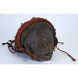 CHOKWE CARVED WOOD FEMALE DANCE MASK, with scarification, copper earrings and braided fabric on