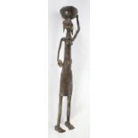 BENIN? AFRICAN BRONZE FIGURE modelled as a slender, bare-chested female carrying a bowl on her head,