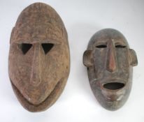 TWO AFRICAN CARVED WOOD MASKS, Tanzanian, 9 ½" (24.1cm) high and Bamana, 12/2" (31.8cm) high, (2)