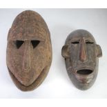 TWO AFRICAN CARVED WOOD MASKS, Tanzanian, 9 ½" (24.1cm) high and Bamana, 12/2" (31.8cm) high, (2)