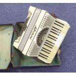 AN ITALIAN ALVARI PAINO ACCORDION IN CASE