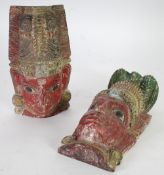 PAIR OF INDIAN CARVED AND PAINTED WOODEN HEADS, flat backed, probably originally finials or part