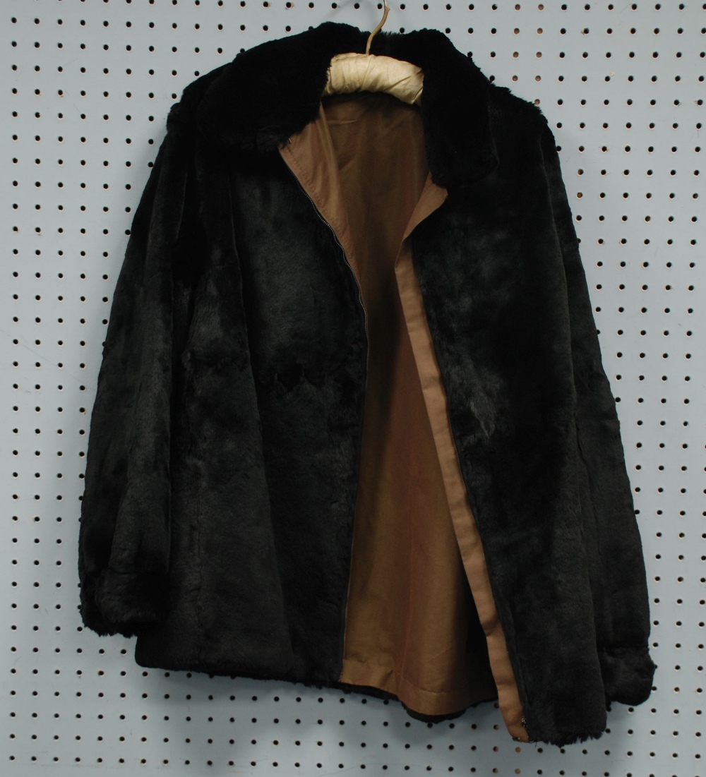 LADY'S BLACK SEAL SKIN JACKET, reversible with a brown gabardine water proof lining, zip front,