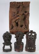 INDIAN CARVED BLOND WOOD PANEL carved in high relief with a deity and two others, 12" x 8" (30.5 x