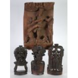 INDIAN CARVED BLOND WOOD PANEL carved in high relief with a deity and two others, 12" x 8" (30.5 x