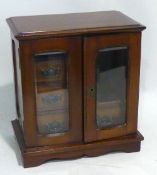 AN EDWARDIAN MAHOGANY SMOKERS CABINET