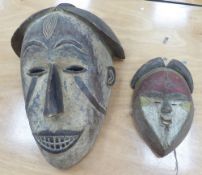 EARLY 20th CENTURY AFRICAN TRIBAL MASK having carved decoration, approximately 20" (50.8cm) and a