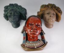 THREE MODERN COMPOSITION WALL POCKETS AND AFRICAN STYLE MASK (3)