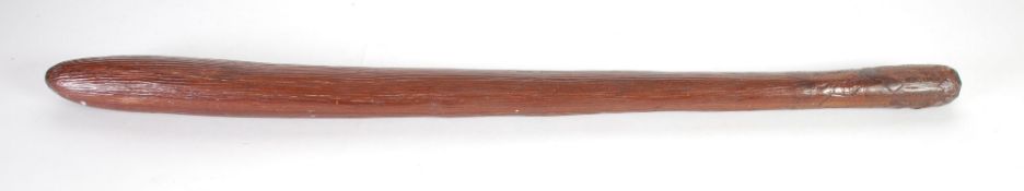 ABORIGINAL CARVED HARDWOOD WAR CLUB of rounded tapered form with simple fluted rustic decoration,