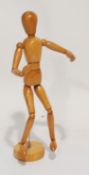 A MODERN MADE IN TAIWAN WOODEN ARTICULATED ARTIST'S LAY FIGURE