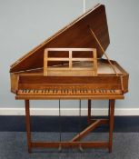 ARNOLD DOLMETSCH WALNUT CASED TRIANGULAR HARPSICHORD with thirty six keys, marquetry inlaid makers