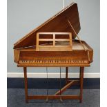 ARNOLD DOLMETSCH WALNUT CASED TRIANGULAR HARPSICHORD with thirty six keys, marquetry inlaid makers