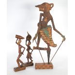 CELONESE, INDIAN HAND PAINTED WOODEN SILHOUETTE PUPPET with moveable arms on an oblong base, 21 1/2"