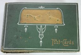 SMALL EARLY TWENTIETH POSTCARD ALBUM, the front with embossed gift panel featuring two dogs,