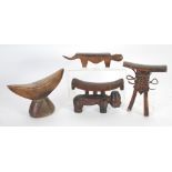 FOUR AFRICAN CARVED WOOD HEAD OR NECK RESTS, including a Lobi example and another of Pokot type(4)